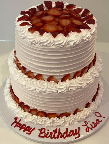 Vanilla Tiered Cake with Whipped Cream and Fresh Strawberries